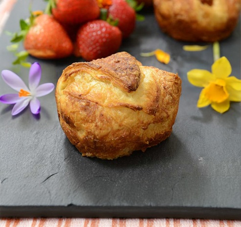 photo of a delicious croissants with figs, nuts and cheeses