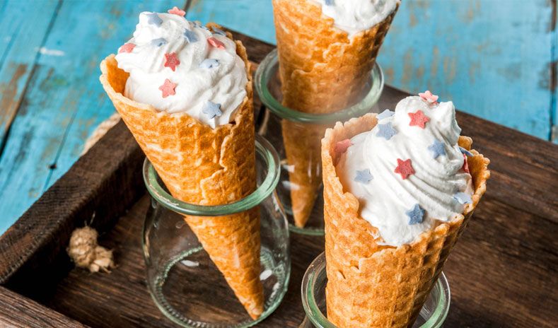 photo of delicious ice cream cones with american themed sprinkles