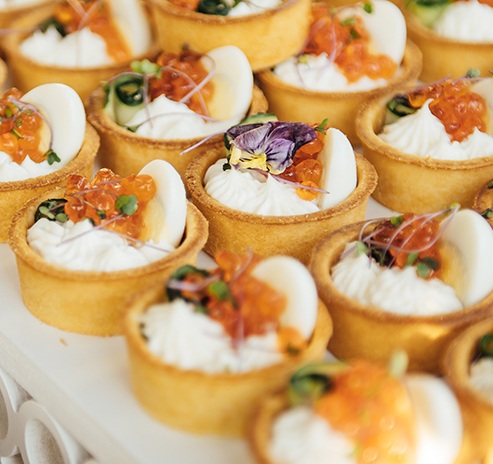 photo of a selection of delicious mini caviar tarts
